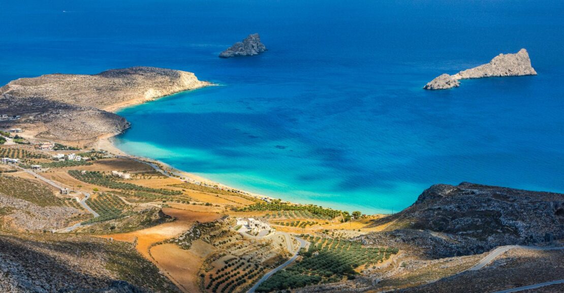 Xerokampos Crete beach with turquoise water and dramatic mountains